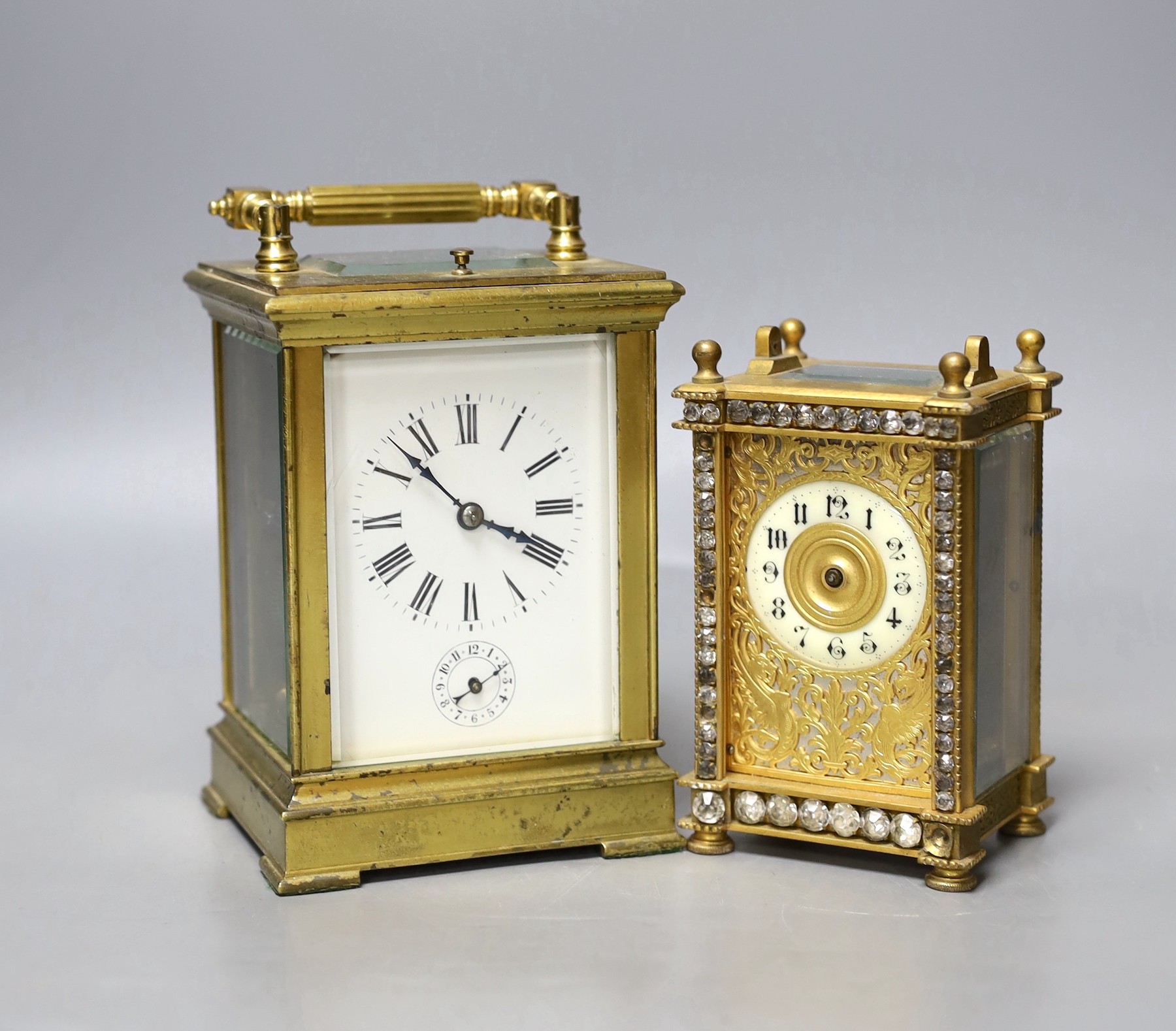 A large French repeating carriage clock with alarm, 16cm. High with handle down and a carriage timepiece